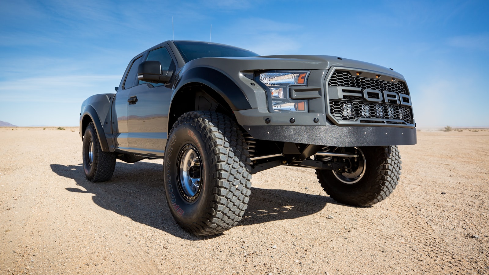 Ford F-150 2021-2025 pickup truck, three-quarter front view in studio lighting